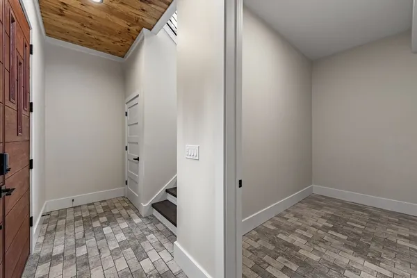 a kitchen with stainless steel appliances granite countertop a refrigerator a sink and dishwasher