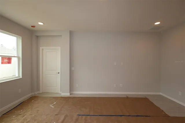 an empty room with windows