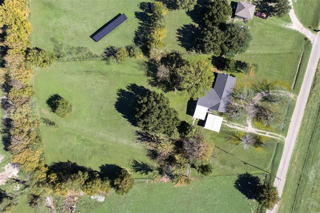 an aerial view of a residential houses with outdoor space