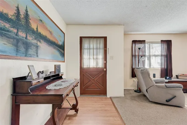 a living room with furniture and entry gate