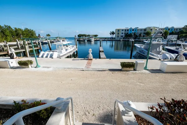 a kitchen with stainless steel appliances granite countertop a stove a microwave and a sink