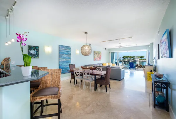 a view of a dining room with furniture and chandelier