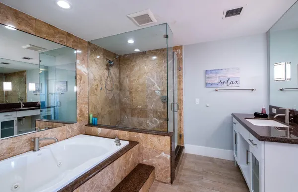 a bedroom with furniture and a flat screen tv