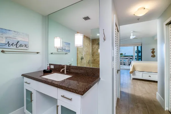 a bedroom with a bed and a couch