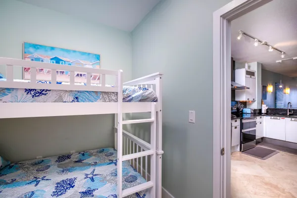 a backyard of a house with yard fountain and outdoor seating