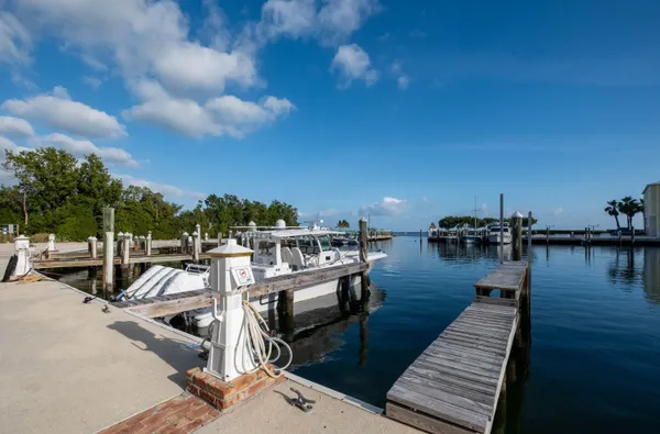a view of a swimming pool with an outdoor seating