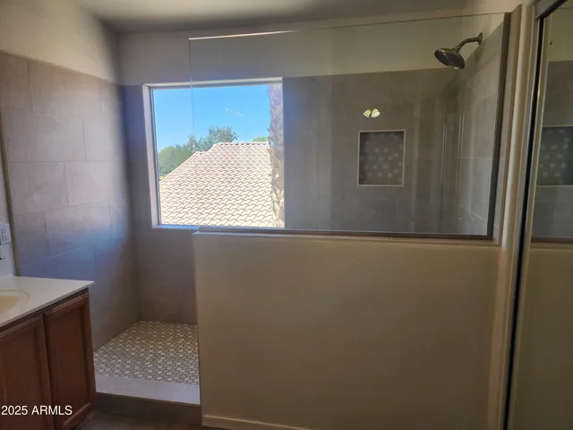 a bathroom with a sink and a window