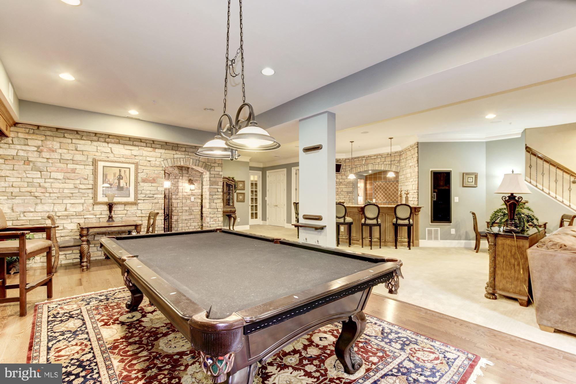 10600 Rivers Bend Lane Potomac, MD 20854 - Photo 33 of 42 Billiard Rm w/Stone Wall open to Bar, Wine Cellar