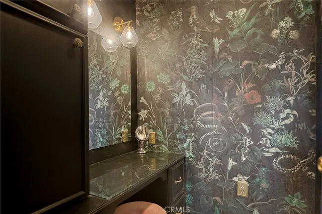 a bathroom with a toilet and shower curtain