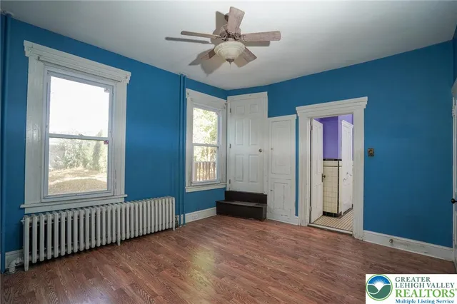 a view of an empty room with a window