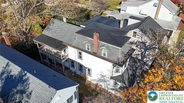 a view of a house with a tree