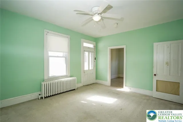 a view of a house with a tree