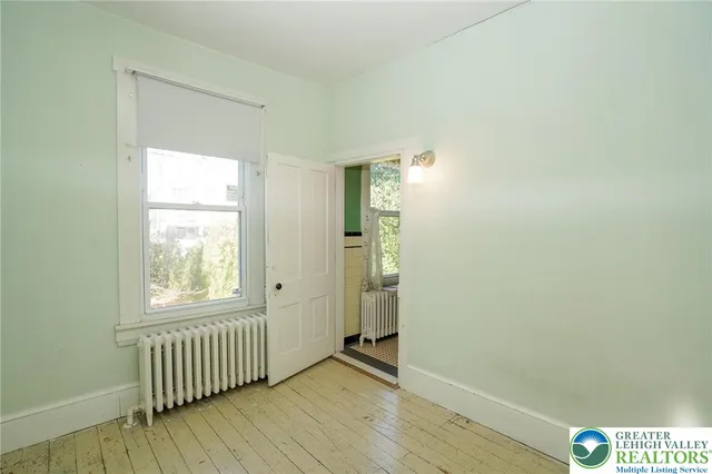 a view of a garage with rack and bicycle