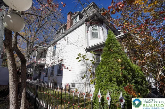 a view of a building with a tree