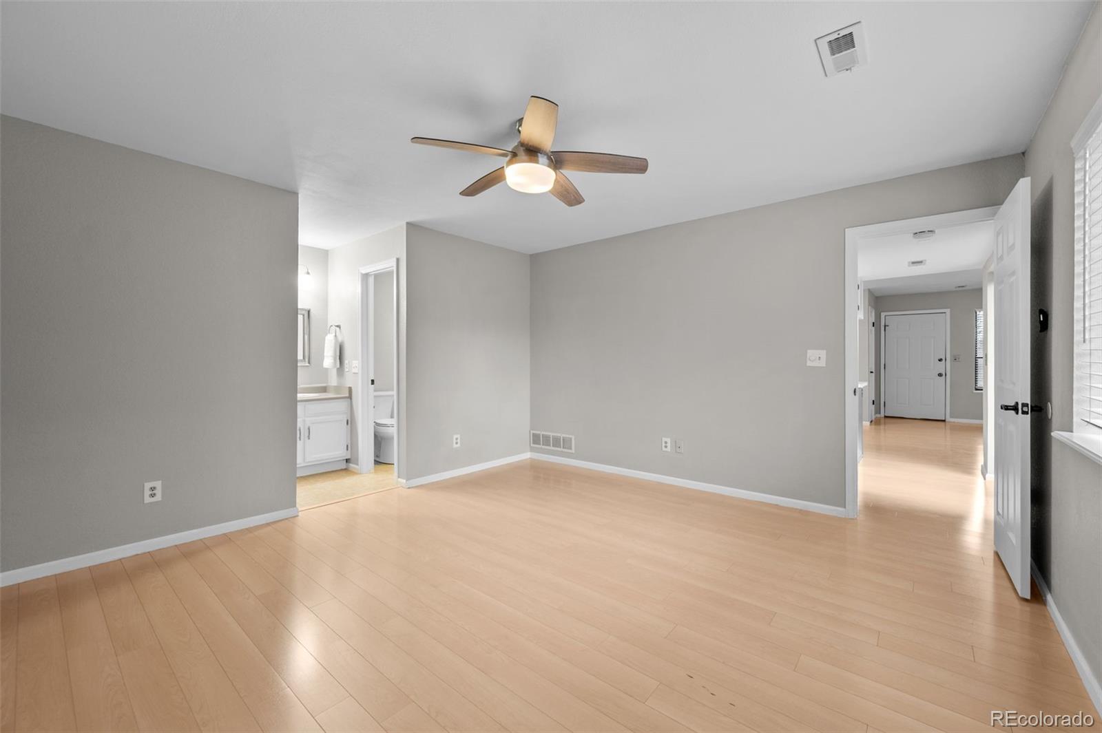 9409 West 89th Circle Broomfield, CO 80021 - Photo 13 of 22 a view of empty room with ceiling fan
