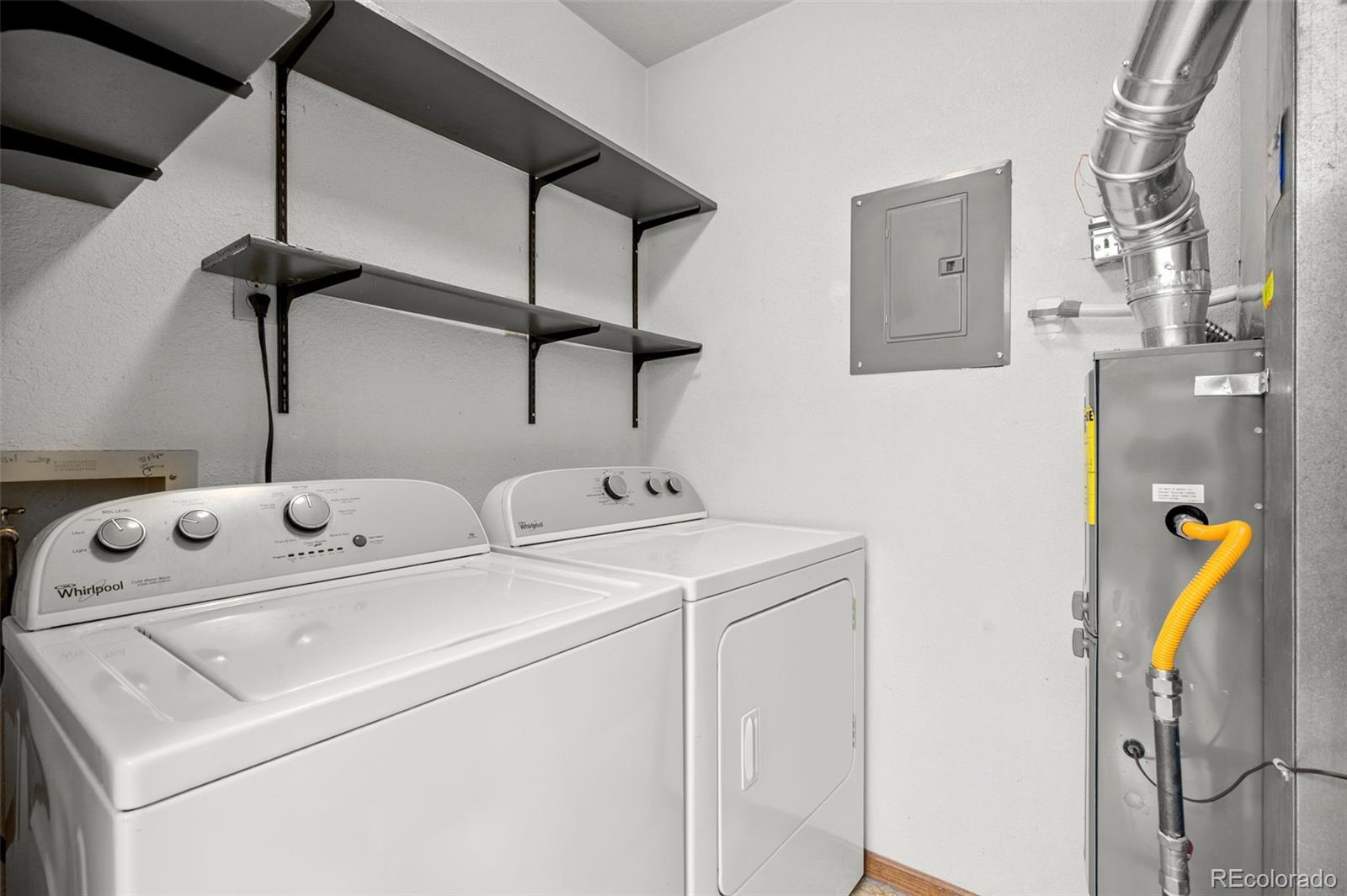 9409 West 89th Circle Broomfield, CO 80021 - Photo 18 of 22 a utility room with dryer and washer