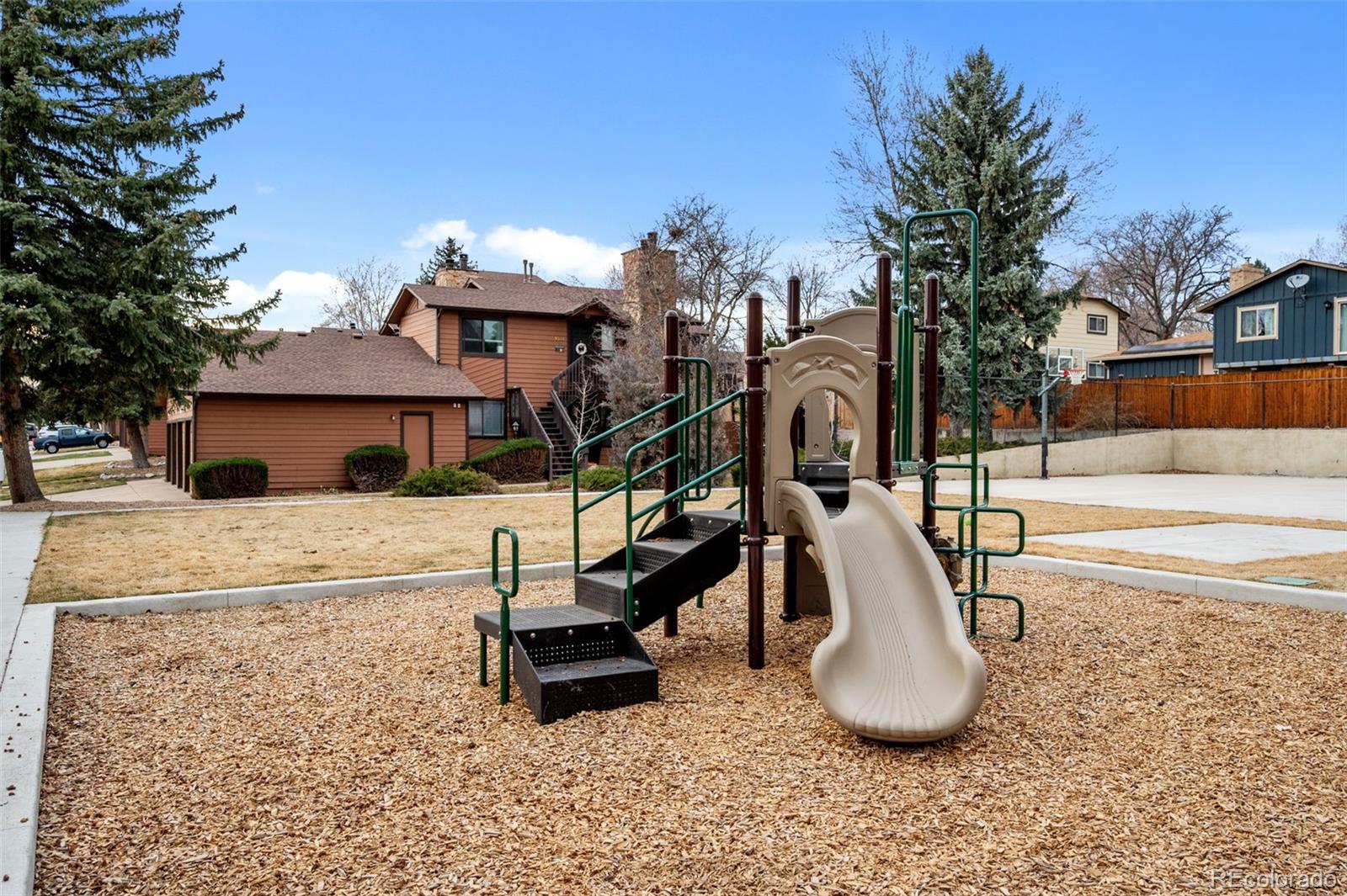 9409 West 89th Circle Broomfield, CO 80021 - Photo 21 of 22 a view of a house with backyard and a tree