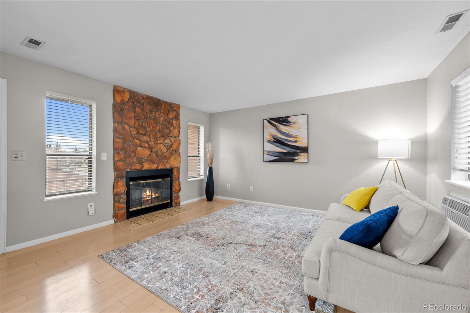 9409 West 89th Circle Broomfield, CO 80021 - Photo 4 of 22 a living room with furniture and a fireplace