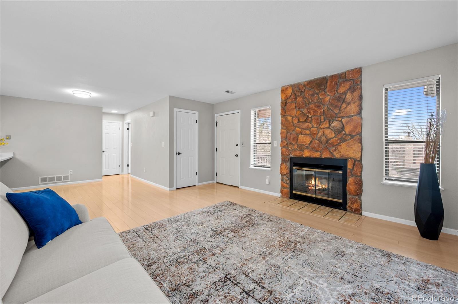 9409 West 89th Circle Broomfield, CO 80021 - Photo 5 of 22 a living room with a fireplace furniture and a fireplace