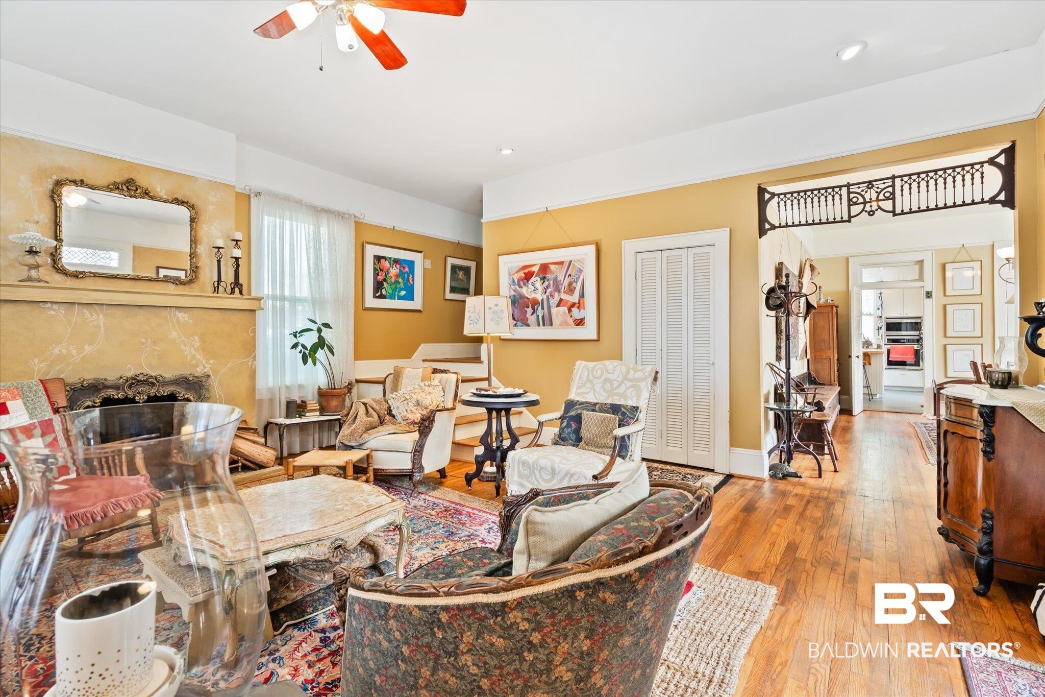 12 Lebaron Street Mobile, AL 36602 - Photo 5 of 37 Living room with light wood-type flooring, ceiling fan, and a premium fireplace