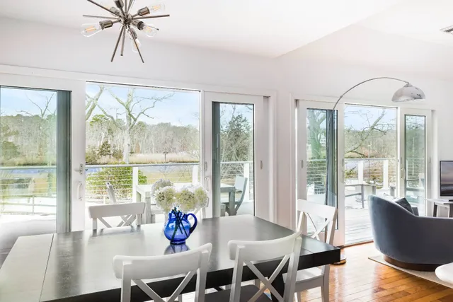 a view of a dining room with furniture window and outside view