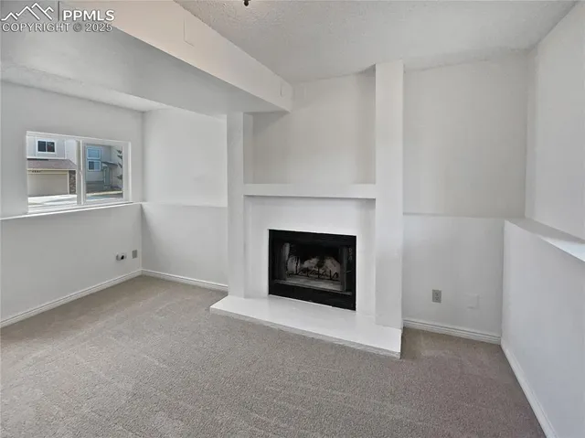 a living room with a fireplace