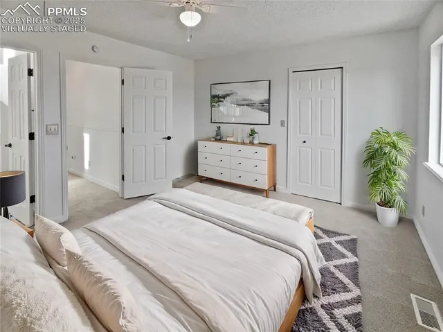 a bedroom with a bed and a closet