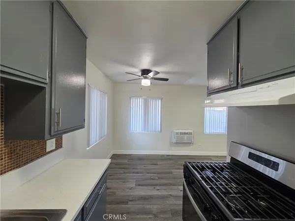 a kitchen with a stove and a refrigerator
