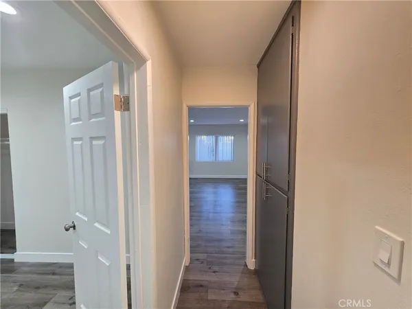 a view of a bathroom from a hallway