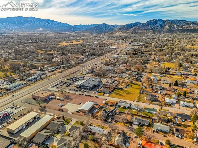 an aerial view of residential building and parking space