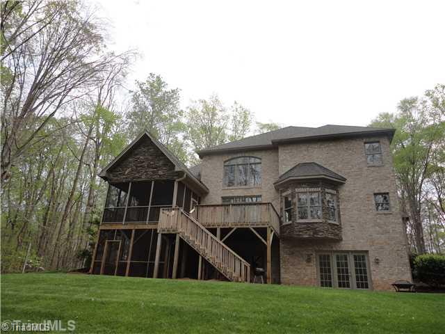 4210 River Ridge Road Pfafftown, NC 27040 - Photo 16 of 16 Exterior Back. Lots of Style and Appeal from the Rear View Double Level Screened Porches, Large Deck Daylight, Walkout Basement