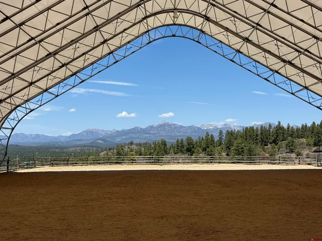 a view of a big yard next to a lake
