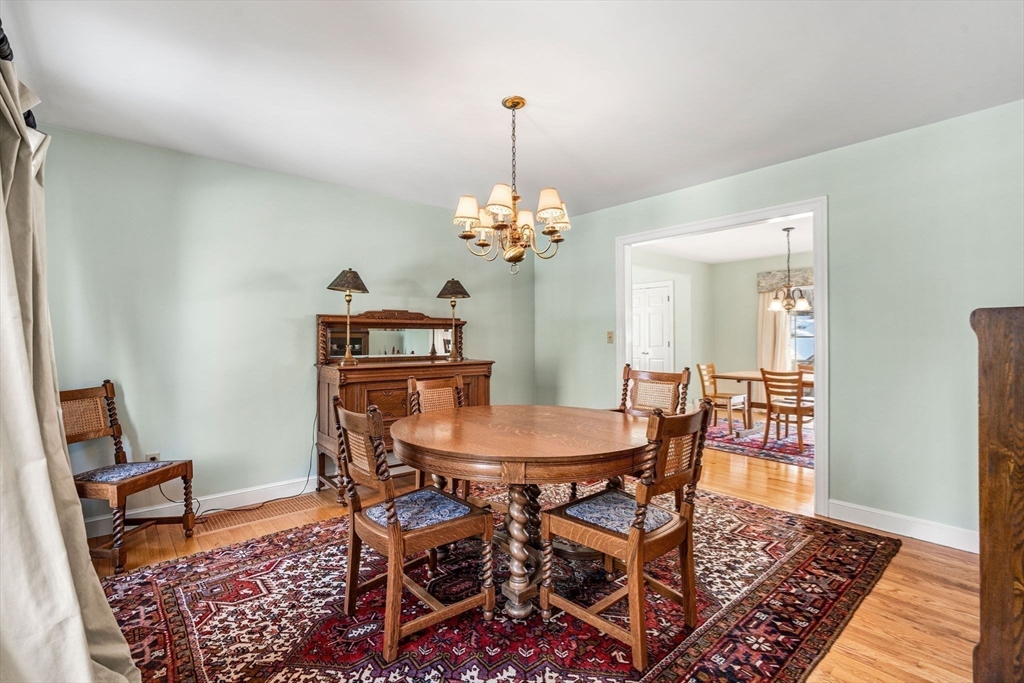 37 Fellows Road Ipswich, MA 01938 - Photo 15 of 42 a dining room with furniture a rug and a chandelier