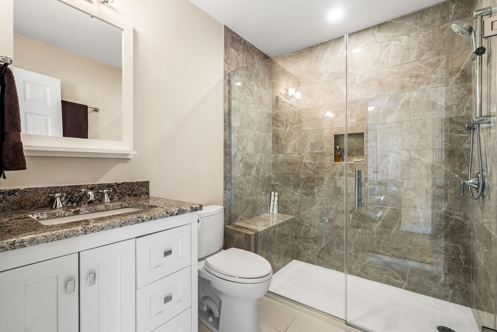 37 Fellows Road Ipswich, MA 01938 - Photo 17 of 42 a bathroom with a granite countertop sink a toilet and shower