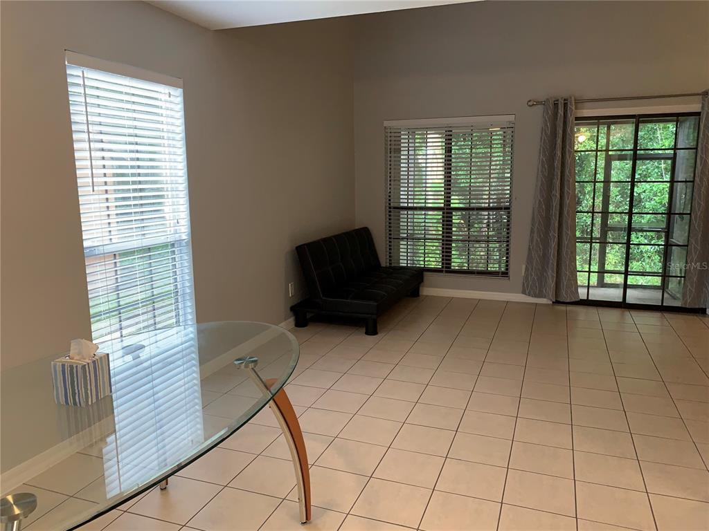 5754 Southwest 8th Place Gainesville, FL 32607 - Photo 10 of 29 a living room with a large window