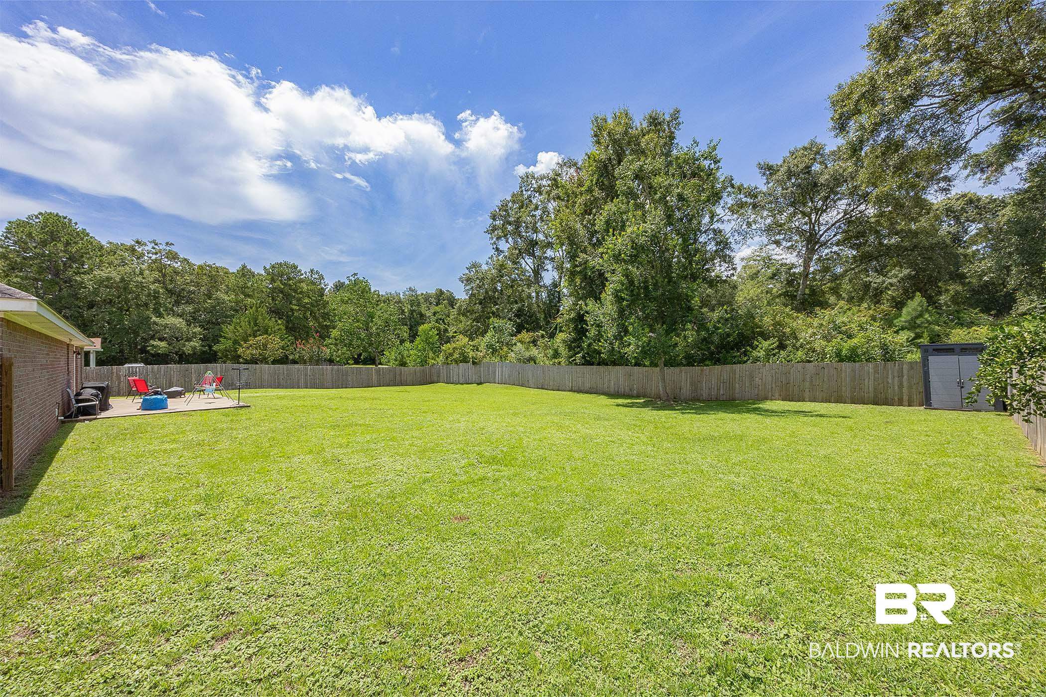 5304 Lansdowne Drive Mobile, AL 36693 - Photo 27 of 28 View of yard with a patio and a storage shed