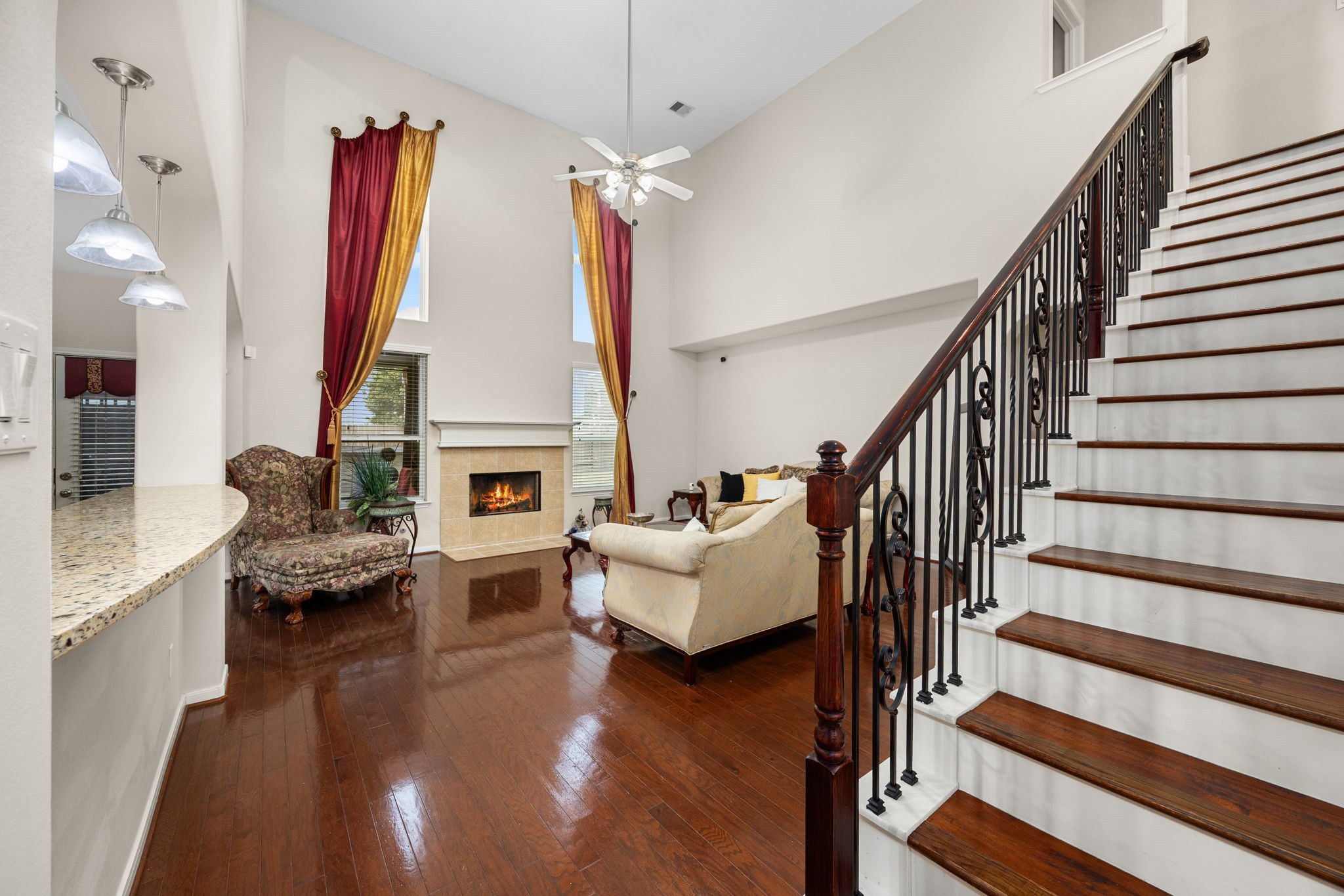 6719 Latchmore Lane Houston, TX 77049 - Photo 4 of 46 a living room with fireplace furniture and a wooden floor