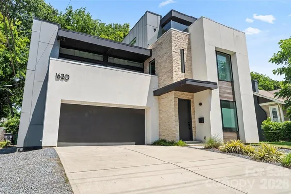 a front view of a house with a garage
