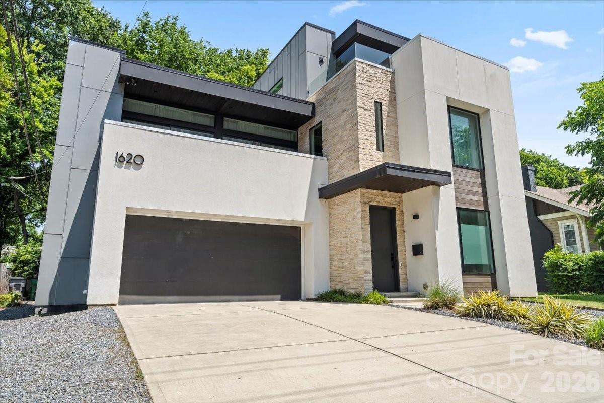 a front view of a house with a garage