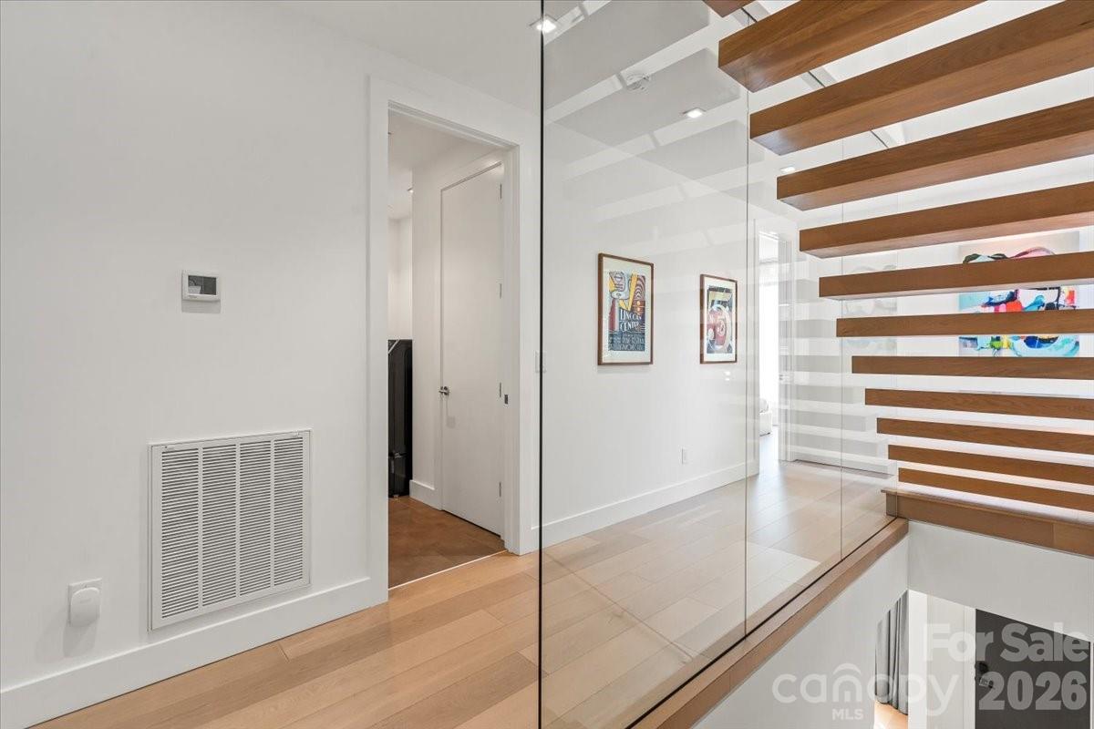 1620 South Tryon Street Charlotte, NC 28203 - Photo 11 of 29 a view of a bathroom with a glass door shower and a sink