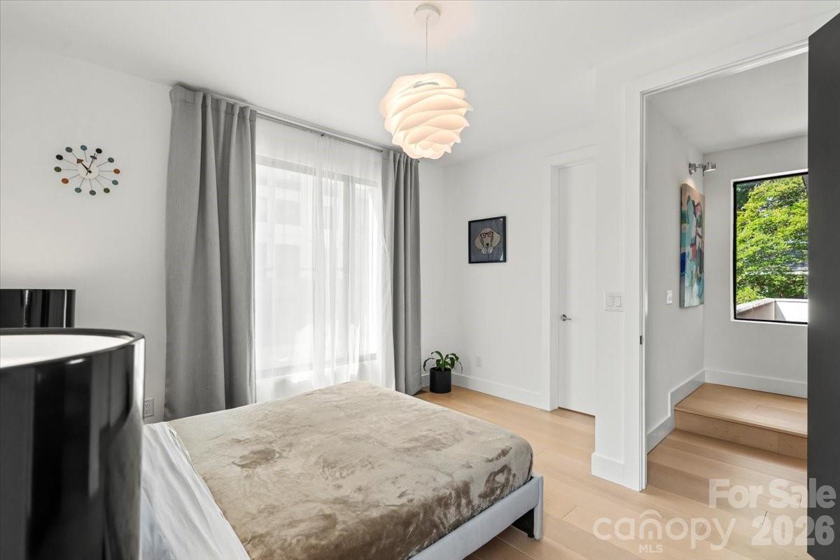 1620 South Tryon Street Charlotte, NC 28203 - Photo 13 of 29 a bedroom with a bed and a window