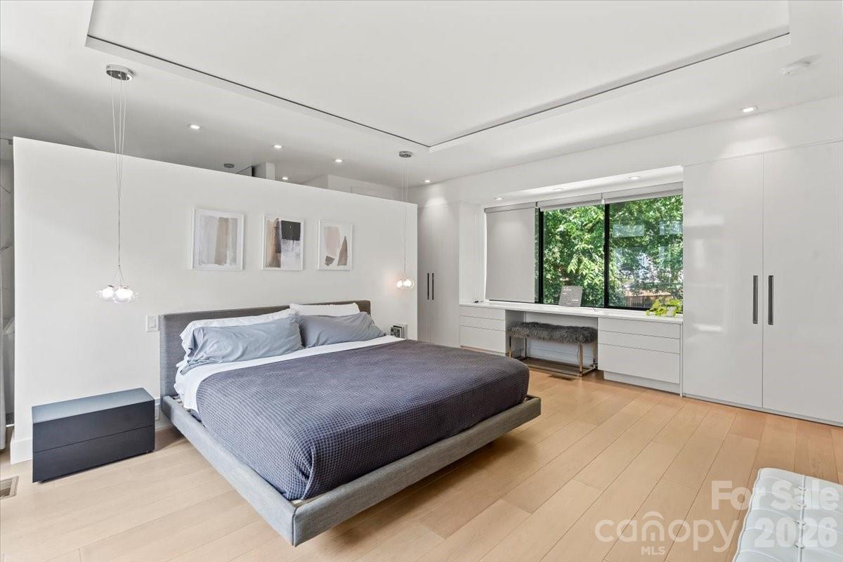 1620 South Tryon Street Charlotte, NC 28203 - Photo 16 of 29 a bedroom with a large bed and a window