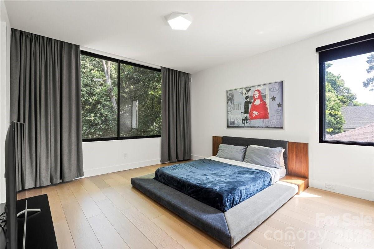 1620 South Tryon Street Charlotte, NC 28203 - Photo 20 of 29 a bedroom with a large bed and a large window