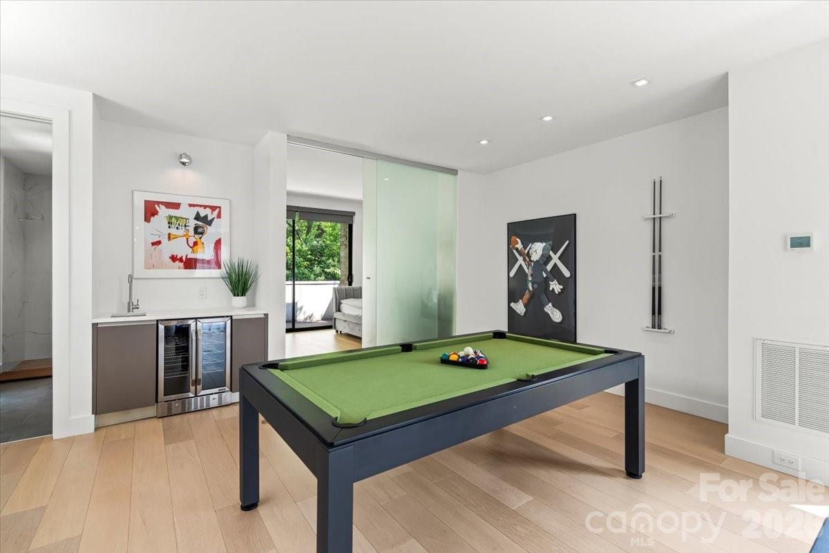 1620 South Tryon Street Charlotte, NC 28203 - Photo 22 of 29 a room with pool table table and windows