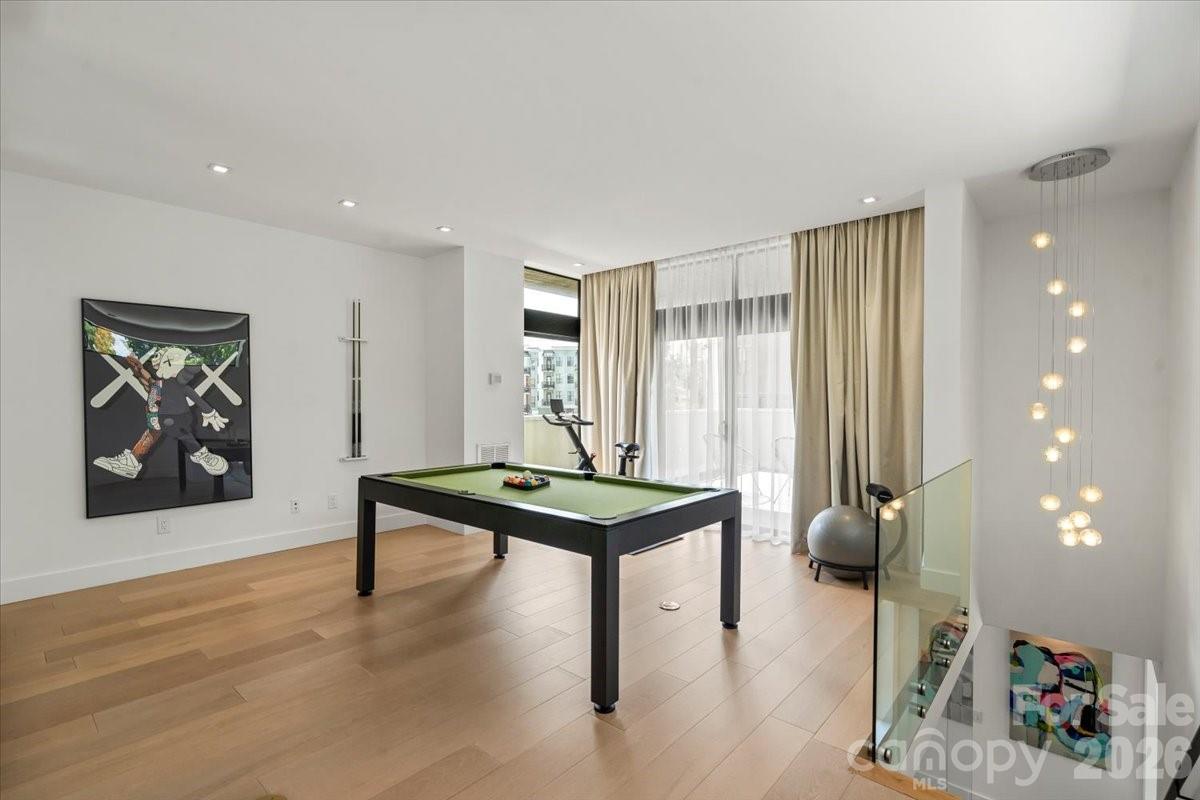 1620 South Tryon Street Charlotte, NC 28203 - Photo 23 of 29 a room with furniture and wooden floor