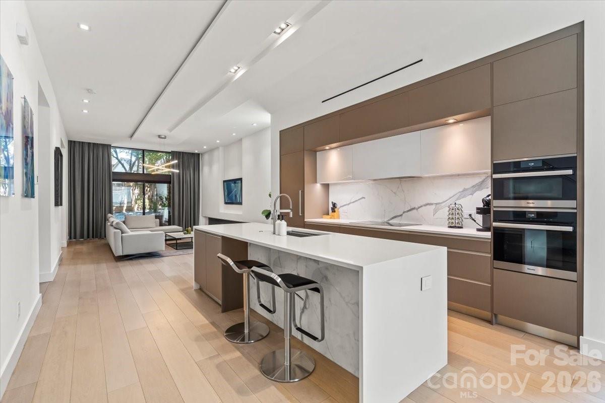 1620 South Tryon Street Charlotte, NC 28203 - Photo 3 of 29 a kitchen with a sink stainless steel appliances and cabinets