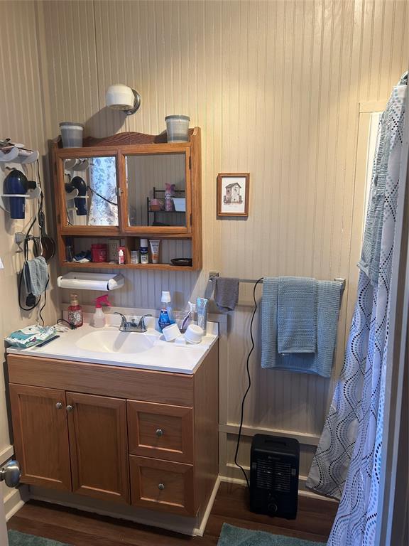 244 County Road 1973 Yantis, TX 75497 - Photo 14 of 16 a bathroom with a double vanity sink mirror and tub