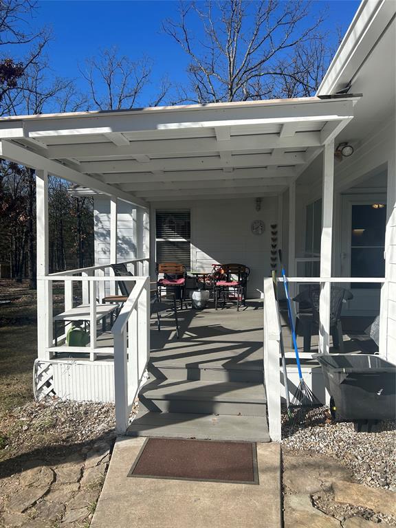 244 County Road 1973 Yantis, TX 75497 - Photo 5 of 16 a view of a living room with wooden floor and plants