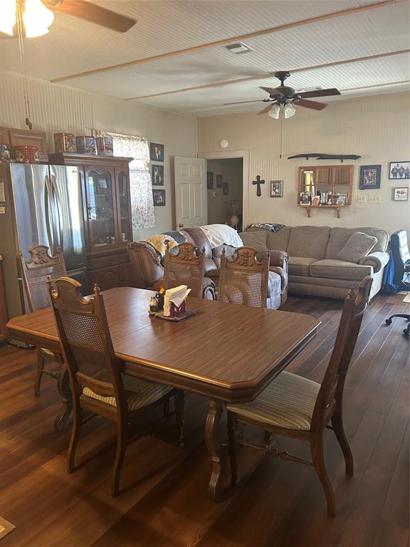 244 County Road 1973 Yantis, TX 75497 - Photo 9 of 16 a view of a dining room with furniture and wooden floor