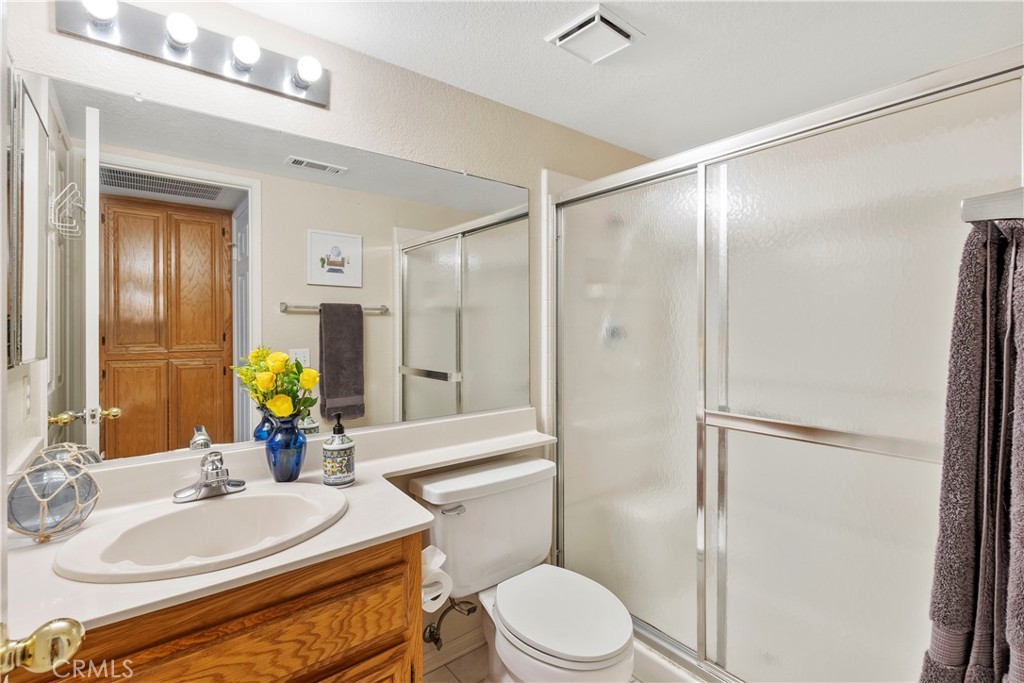 6879 Mission Grove Parkway North Riverside, CA 92506 - Photo 12 of 53 a bathroom with a sink toilet and shower